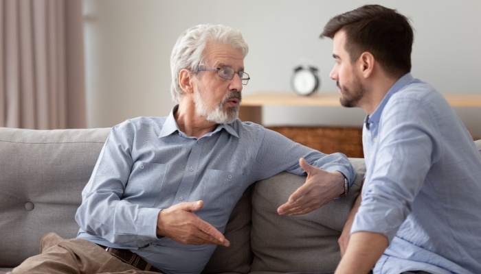 A father and son having a serious conversation.